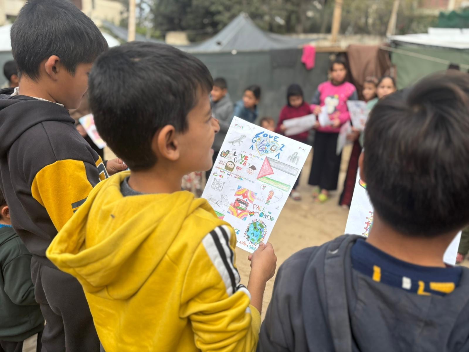 Boy holding peace drawing
