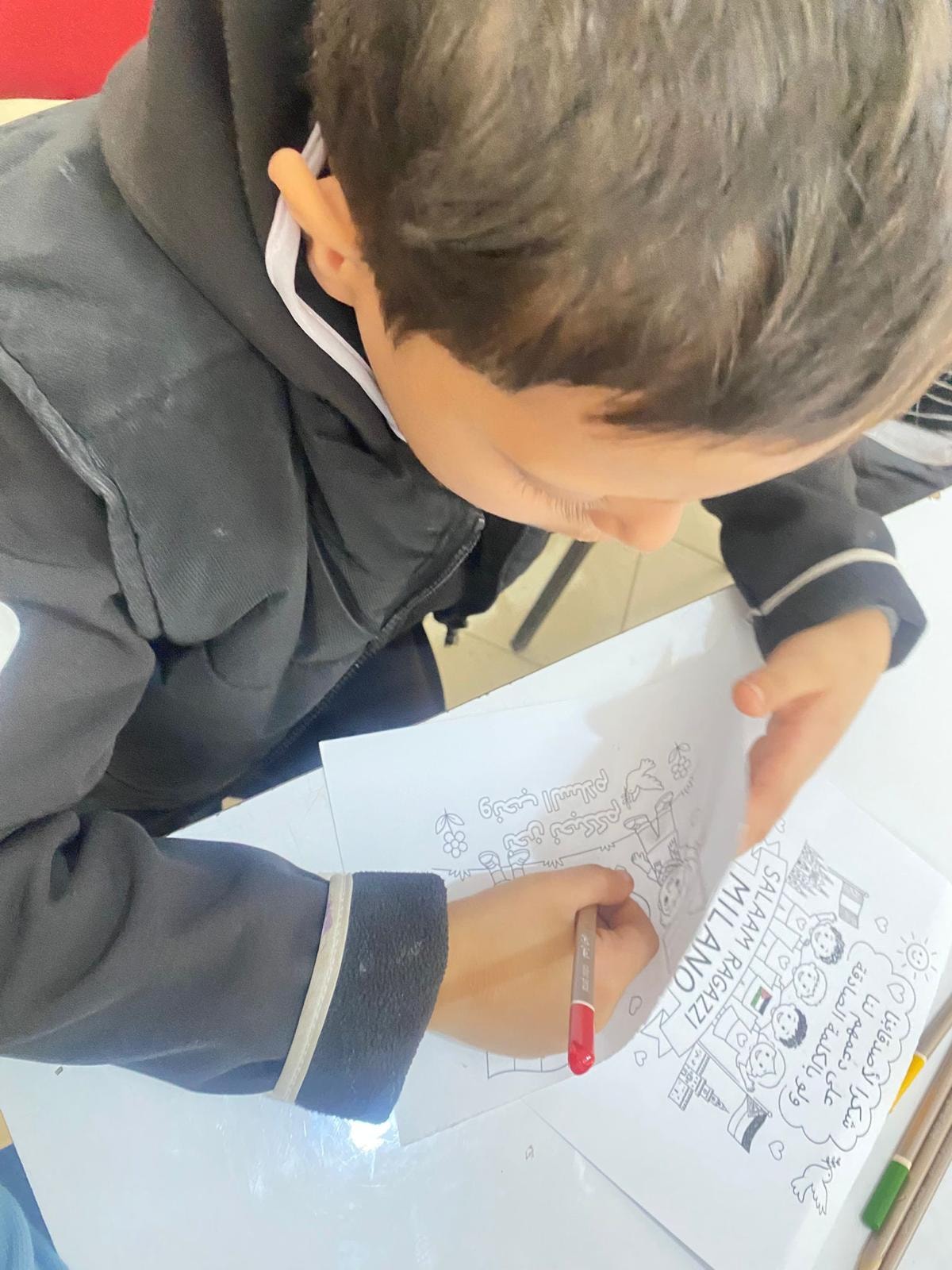 Girl holding drawing